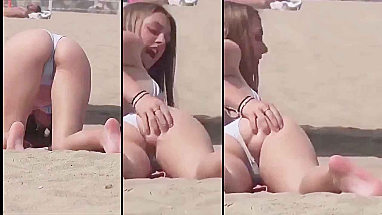 White teen squeezes her ass on the beach REAL VOYEUR CAM